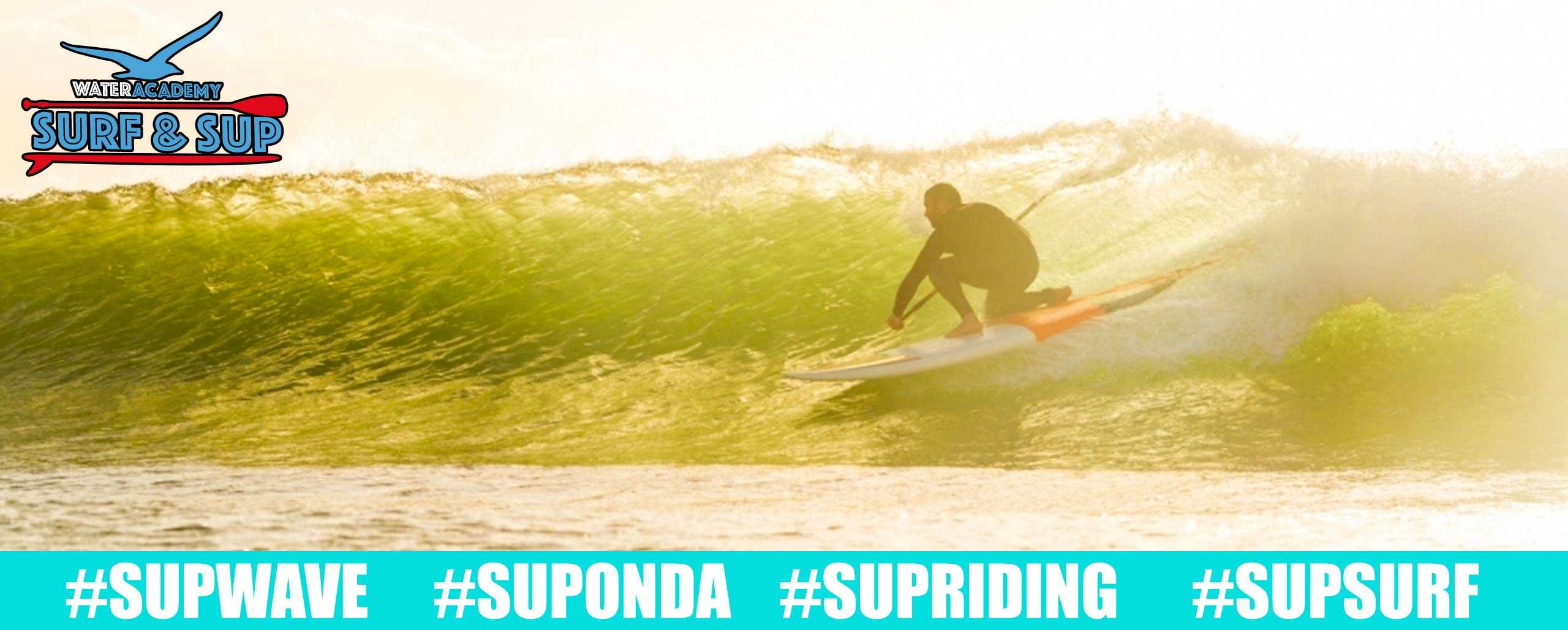 Sup surf riding wave